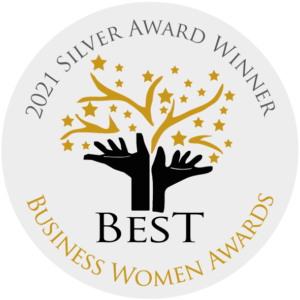 A circular badge with "2021 Silver Award Winner" at the top, two black hands reaching for gold stars in the centre, and "BEST Business Women Awards" written at the bottom.