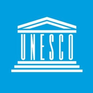 UNESCO logo featuring a white outline of a Greek-style building with 